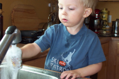 max_refills_mug_at_sink.JPG